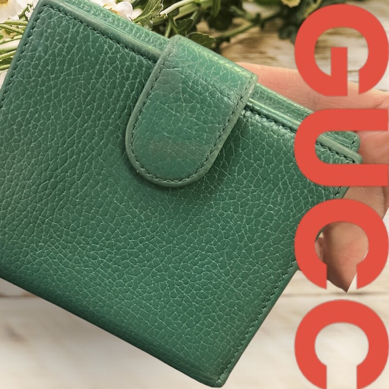 GUCCI<br />
green leather bifold<br />
the wallet has signs of wear, but with lots of life left.  No rips or stains.<br />
comes with certificate of authenticity<br />
retails originally: $543.
