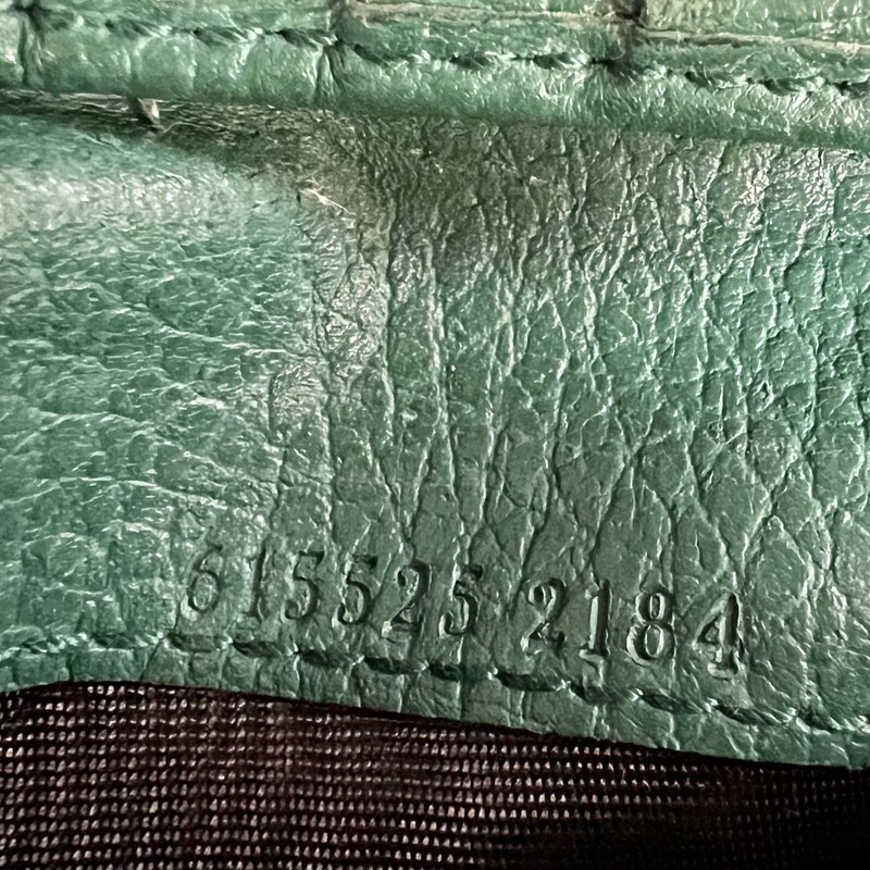GUCCI<br />
green leather bifold<br />
the wallet has signs of wear, but with lots of life left.  No rips or stains.<br />
comes with certificate of authenticity<br />
retails originally: $543.