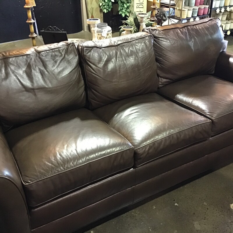 This Ethan Allen Bennett leather three-seat sofa has classic design written all over it.  Featuring luxurious leather, opulent rolled arms and welted loose cushions<br />
<br />
Tailored by hand over a durable engineered wood frame.<br />
<br />
Poly-wrapped high-quality foam and fiber cushions for a supportive seat.<br />
<br />
Removable, tapered legs shown in Raisin, a rich, cool, dark brown water-based finish.<br />
<br />
This sofa is priced $50 less than the matching sofa due to a small mark on the leather<br />
<br />
Matches # 170099<br />
<br />
Dimensions:  87 x 37 x 36