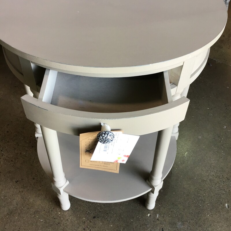 This beautifully updated demilune table was painted by one of our local artists using Country Chic Driftwood paint and clear wax. It features a small drawer, funky knob and lower shelf.<br />
Dimensions are 24 in x 14 in x 29 in