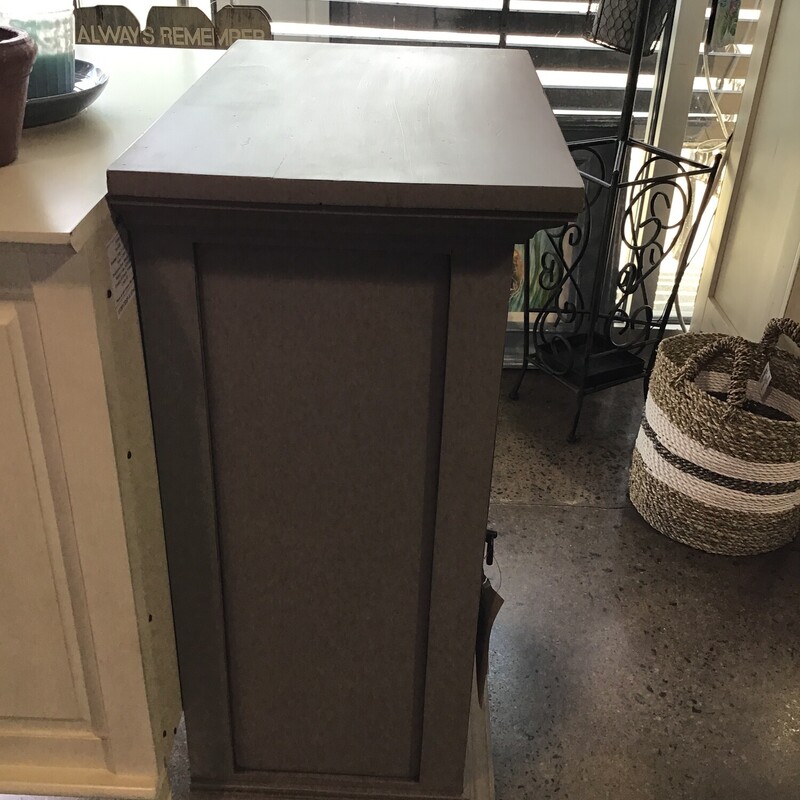 This super neutral cabinet was painted by one of our local artists using Country Chic Driftwood paint and a combination of clear and dark wax. It features a glass door and lower shelf.<br />
Dimensions are 20 in x 13 in x 31 in