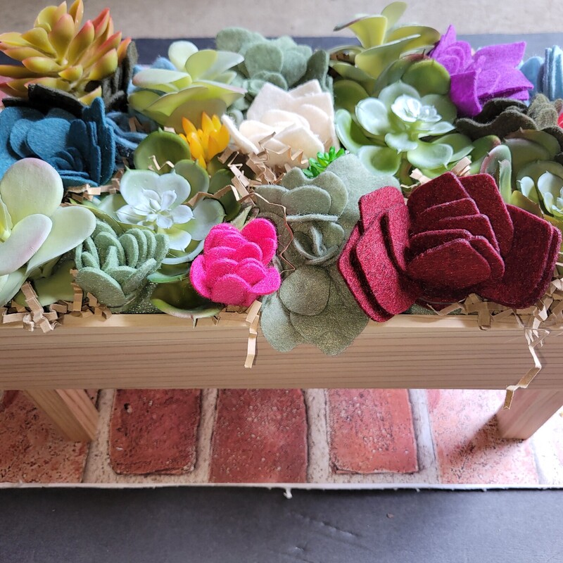 Planter box filled with felt and artificial succulents