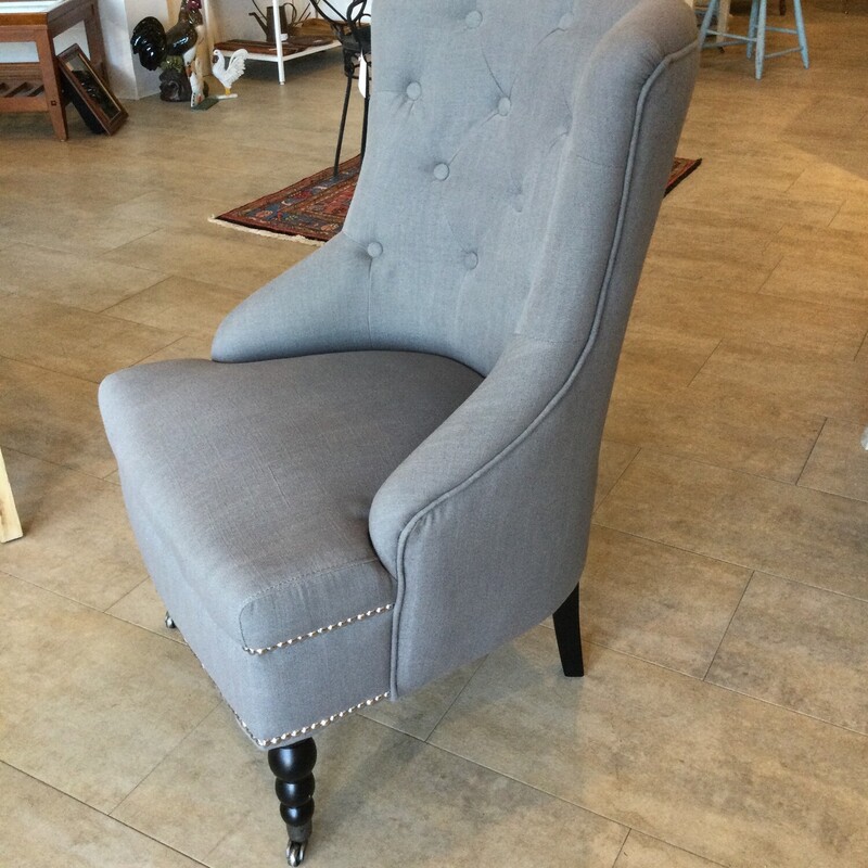 Tufted Accent Chair With Nail Head Accents<br />
Turned legs With Castors<br />
Grey<br />
Size: 24 X 28 In