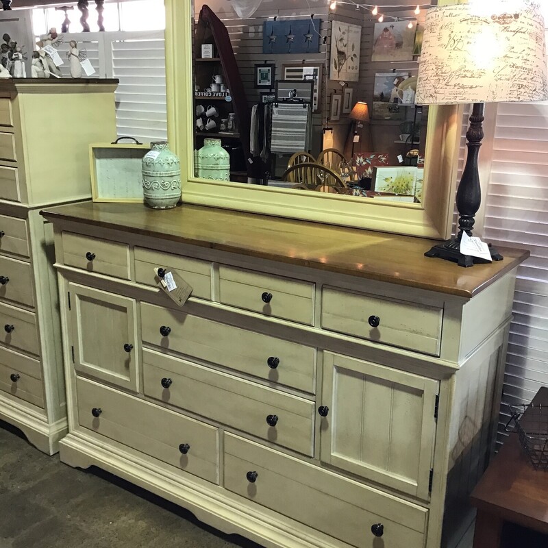 This beautiful two-tone dresser features a plank-style top stained in a medium brown and cream base. It has soft close drawers, 2 small and 1 large skinny felt-lined drawers, 2 cabinet doors and 4 drawers. There is also an attached mirror that is in the cream finish. This piece was purchased from Furniture Galleries about 7 years ago.
Dresser Dimensions - 64 in x 19 in x 42 in
Mirror Dimensions - 46 in x 36 in