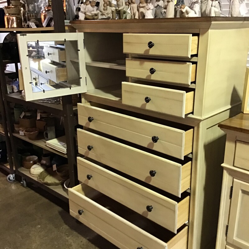 This beautiful two-tone chest features a plank-style top stained in a medium brown and cream base. It has soft close drawers, 3 small and 4 large drawers and 1 cabinet door.  This piece was purchased from Furniture Galleries about 7 years ago.
Dresser Dimensions - 40 in x 19 in x 60 in