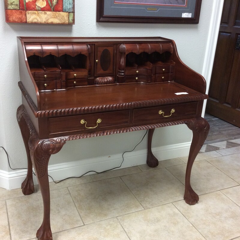 This is a very beautiful, unique desk. This desk has 2 standard drawers 8 mini drawers and 5 hidden drawers. It has recently been re-finished and is in great condition.