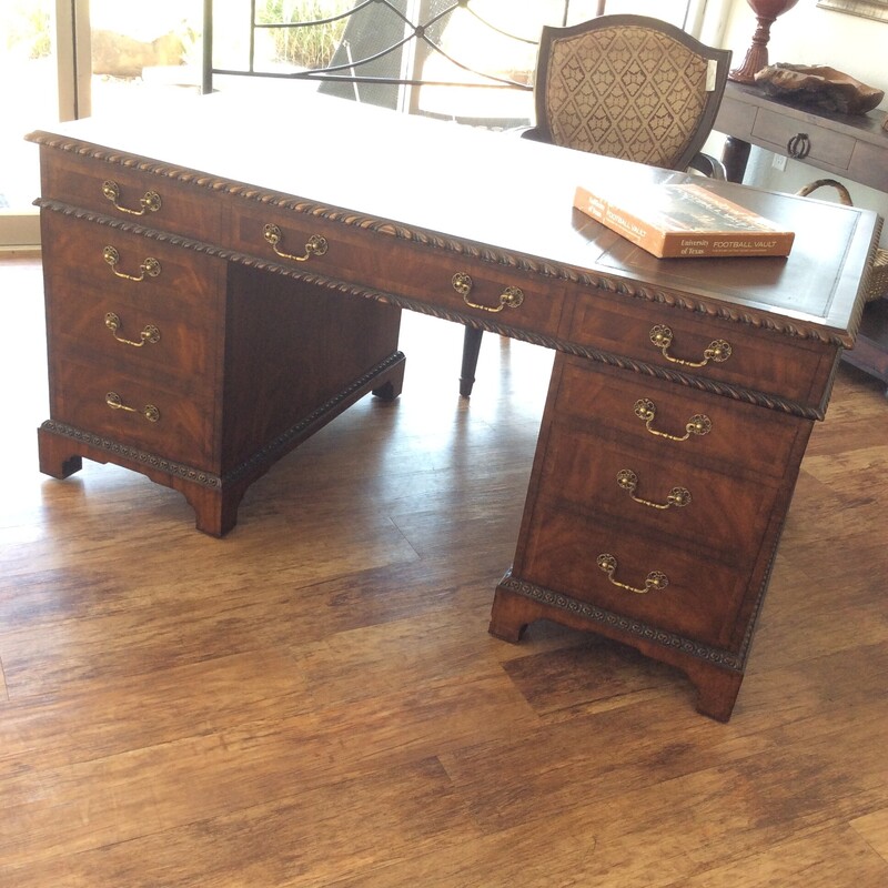 This is a beautiful walnut Executive Desk from the Ellis Line from Sligh. This desk has a faux drawer front look. The desk has 2 file cabinet drawers, 4 standard drawers and a keyboard drawer.
