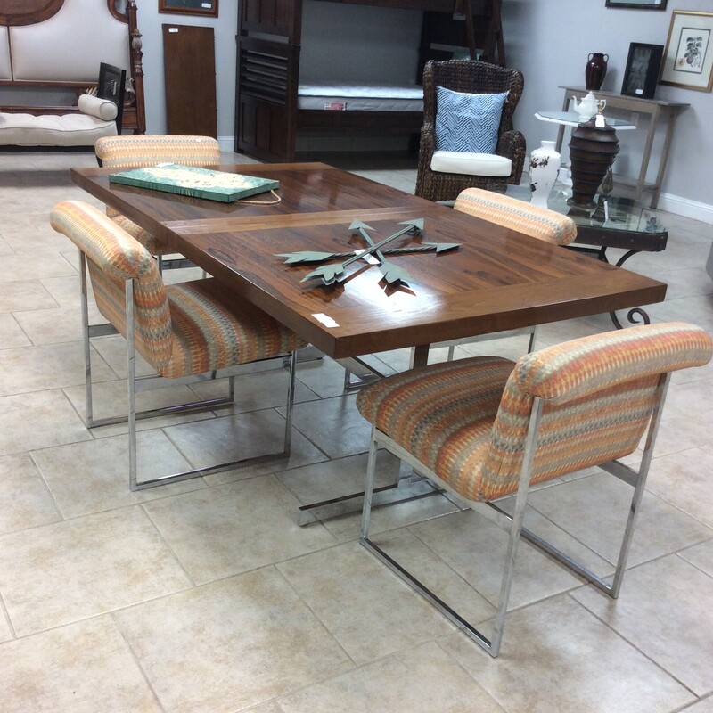 This is a very nice retro wood and chrom table with linen orange and chrome legs. This table has 1 leaf.