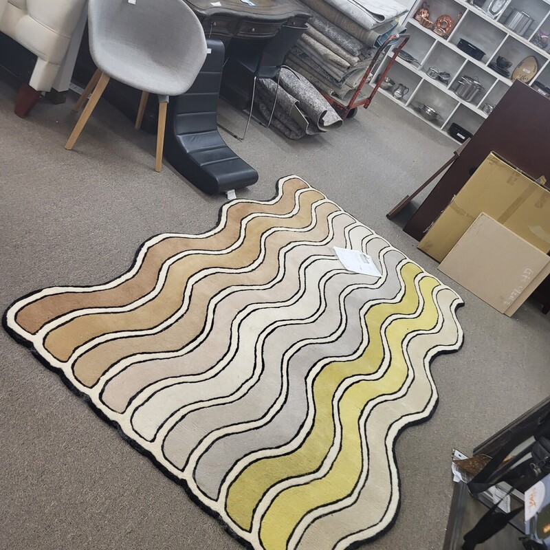 Wavy 5X8 Desert Wool
The Wavy Rug Collection (2021) began as an exhibition project. Drawing from their roots in fashion and interior design, creators An Aesthetic Pursuit started with a single rug that featured ripples in a rainbow of hues. They then extracted snippets of that design, magnifying those sections to create rugs of different sizes, shapes, and color combinations. Made of hand-dyed wool, this beautiful, durable rug suits high-traffic contract and residential areas such as hallways and living rooms. Made in India.

    Hand-tufted wool rug with undulating, multicolored stripes.
    Wavy stripes create the illusion of motion.
    Suited for high-traffic contract and residential areas.
    Multiple pile heights and textures.