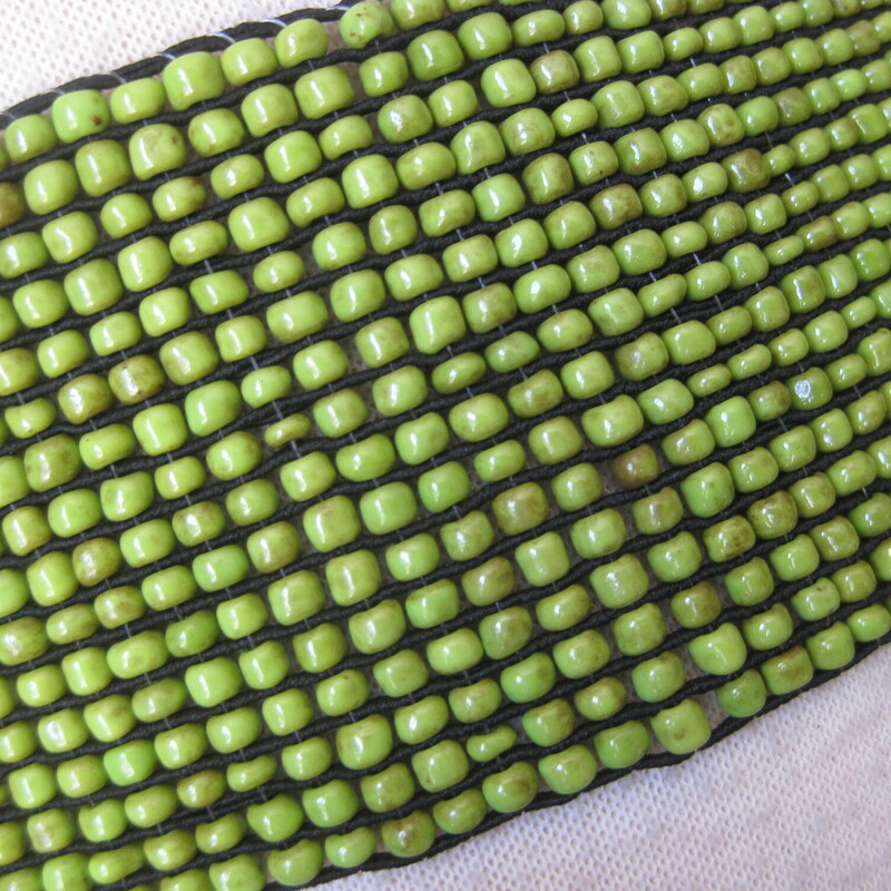 This nice beaded belt has a woodland vibe.  It's a stretch belt in green beads with two wooden hooks as the clasp.<br />
The beads have a natural gradation in color which gives the belt an organ ic dimensional look<br />
Nice and stretchy will fit 28 to about 33 waists.<br />
Appear to have never been worn, the tags are attached.<br />
<br />
Thank you for looking!<br />
#2140