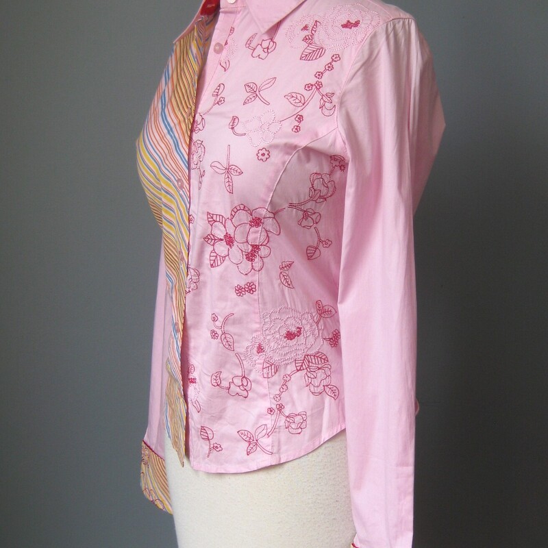 Pink Cotton Shirt with a touch of spandex embroidered with flowers on one side of the front and striped on the other side. the back is plain. The cuffs combine the striped material with the embroidery to pull it all together.<br />
Super cute by Pepe Jeans London<br />
like new condition.<br />
Marked size M, but SMALLER, my mannequin is about a size 4 and it was very snug on her.<br />
here are the flat measurements, use these not the tag to determine if it will fit you.<br />
S-S: 14.25<br />
SL: 18.5<br />
A-A: 18.5<br />
Waist: 16<br />
L: 22.75<br />
Thanks for looking!<br />
#58872
