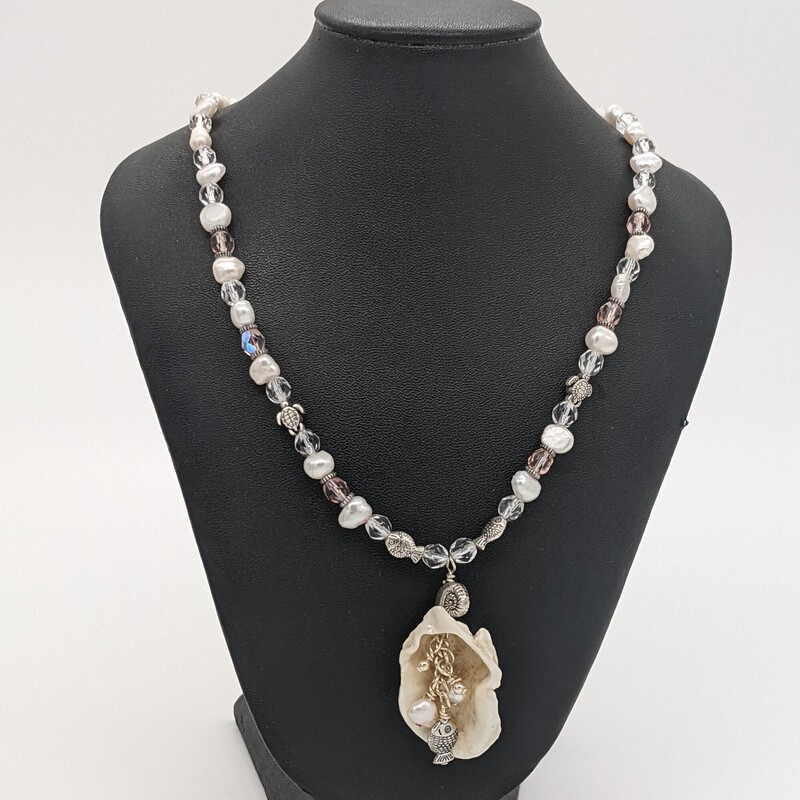 Oyster Shell Necklace
Jama Watts
Jewelry
16 in long
Oyster shell collected from Fort Monroe Beach, coated in resin, with chain made from freshwater pearls, Czech glass and silver-tone charms.  Lobster clasp.