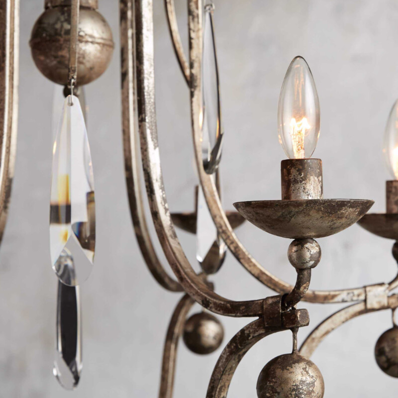 Arhaus Bonita Chandelier<br />
Silver Brown Gold  Size: 29x29x28H<br />
Handcrafted of iron. Distress finish.  Italian crystal teardrops for dramatic sparkle.  Simply Stunning.<br />
Holds 6 Bulbs<br />
Retail $2549<br />
Matching Wall Sconces Sold Separately