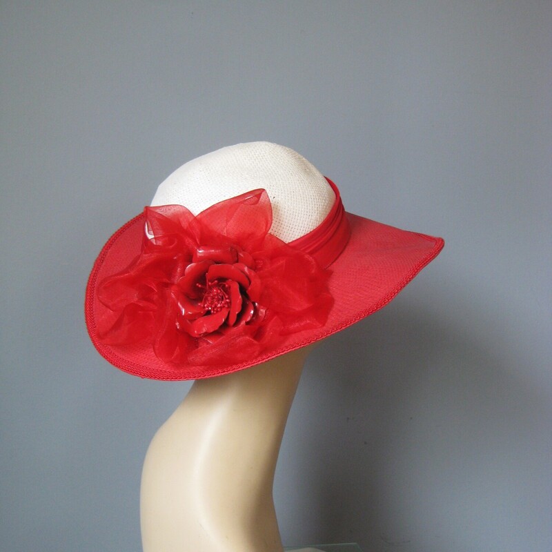Gorgeous statement hat in red panama with round crown, floral decoration and wide riibon
Perfect for race day, summer weddings and dressing up.The round white crown is surrounded by a red ribbon, finished with a hard red plastic rose.
The red is a bright red and the white is a soft white, not stark.
the inner hat band measures 21.5 around
Excellent condition.  It's been in imperfect storage for a long time and has a tiny amount of lost shape in the crown but this could probably be steamed out easily.
Hat will be shipped carefully packed in a box.

Thanks for looking!
#3112
