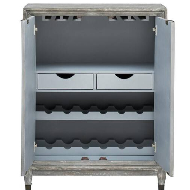 Chevron Wood Wine Bar<br />
Distress Blue Grey Chevron Doors<br />
Size: 33x16x43H<br />
Featuring ample wine rack storage, several hanging stemware racks, two drawers and a fixed shelf. This cabinet also comes with 2 wine bottle trays in which the middle tray gives you the option to filp and make a full shelf for extra shelving space.<br />
NEW<br />
Retail $899