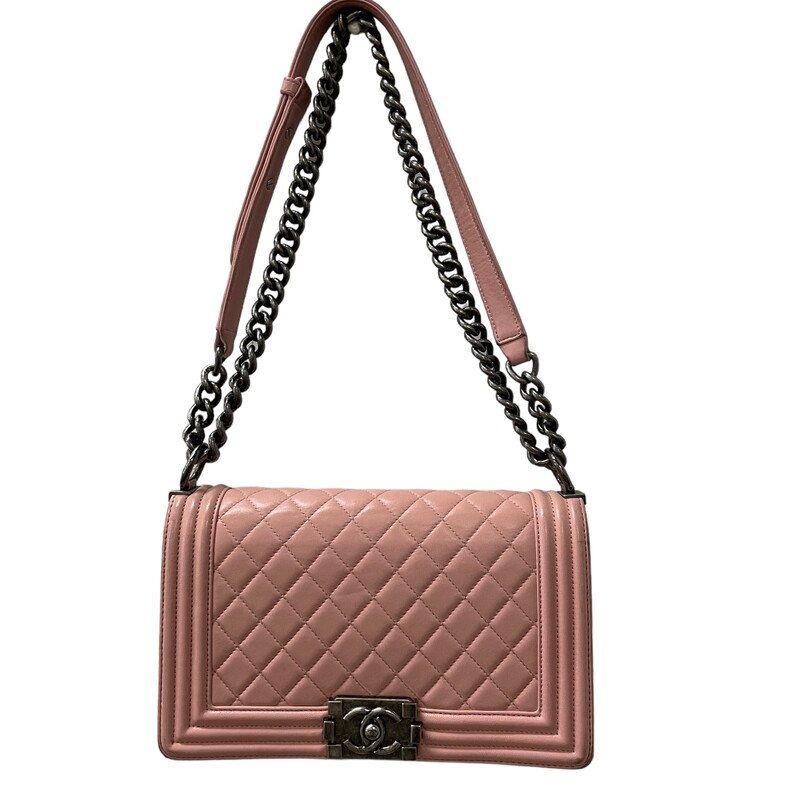 Chanel Boy Lambskin<br />
From the 2015-2016 Collection by Karl Lagerfeld<br />
Pink Lambskin<br />
Antiqued Silver-Tone Hardware<br />
Chain-Link Shoulder Straps<br />
Grosgrain Lining & Single Interior Pocket<br />
Push-Lock Closure at Front<br />
<br />
Some wear on corners see pic for reference<br />
Code: 20110342<br />
Demension: H:5.7'' x W:9.8'' x D:2.6''