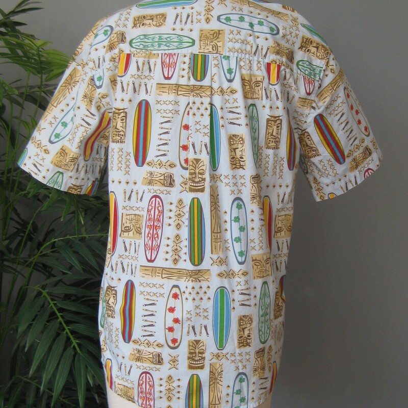 Old Navy Tiki SS Bttndwn, Blue, Size: BOYS 2x<br />
Very cool tiki print featuring surf boards and polynesian masks on an aqua blue background.<br />
Sturdy cotton with short sleeves.<br />
It's new, never worn.<br />
<br />
Marked size XXL<br />
Flat measurements:<br />
shoulder to shoulder: 19<br />
armpit to armpit: 20<br />
width at hem: 20<br />
length: 28.75<br />
<br />
This would fit a girl too, but it's a bit slim in the bust area for anyone with a bust,  it barely buttons around my mannequin which is about a womans size four.<br />
<br />
Thanks for looking!<br />
#4158
