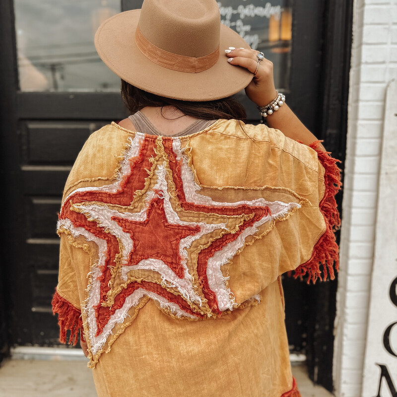 This stunning kimono is high quality and one of a kind! Layers of stitched stars make this piece one that turns heads! The warm tone burnt colors look beautiful with the distressed fringe sleeves!