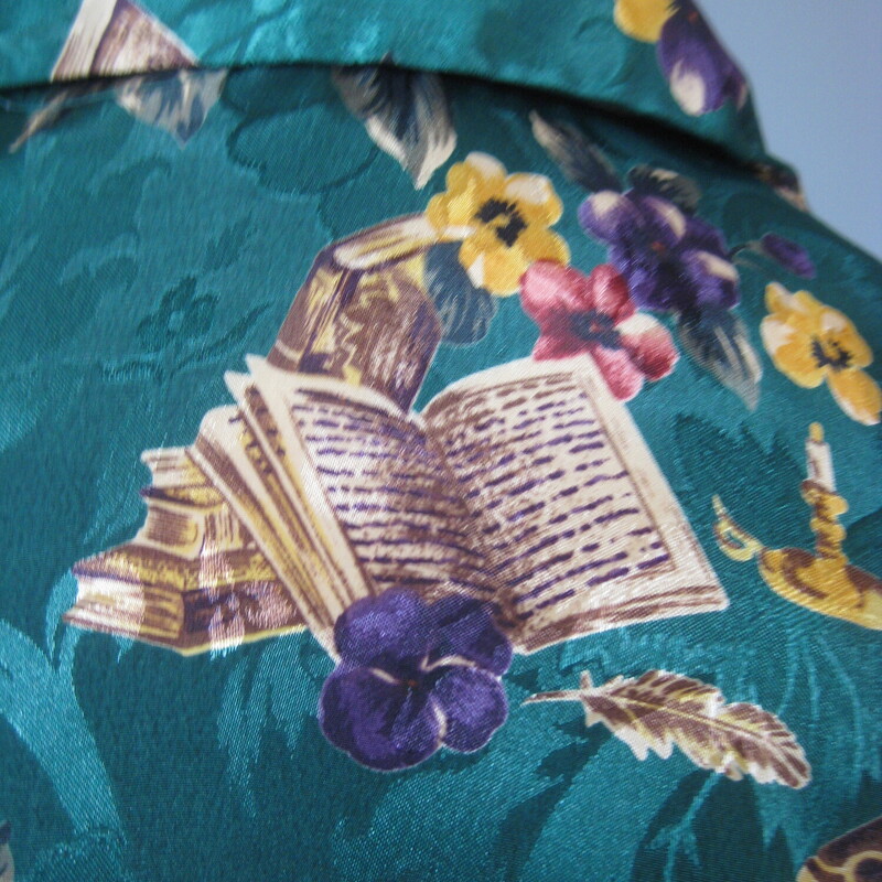 Vtg Silky Book Shirt, Green, Size: Medium<br />
This is the PERFECT gift for your book nerd Friend !  Especially if they are enamoured of French Novelists.<br />
<br />
It's a silk (but probably polyester) charmeuse jacquard in dark teal green, covered with purple and red flowers and sprinkled with candlesticks and books labled Balzac, Zola and Norwood ( apparently Norwood is a town in England to which the auther Zola fled after getting mixed up in the infamous Dreyfus case)<br />
so fun and if you are or have a Lit grad student in your life how cute and unique would this be as a gift.<br />
<br />
Excellent condition<br />
Flat measurements, please double where approrpriate:<br />
Shoulder to shoulder: 17<br />
Armpit to Armpit: 22<br />
Width at hem: 21.25 (it has a shaped hem so it will fit more smoothly if you want to tuck it in)<br />
Length: 23.5<br />
<br />
thank for looking!<br />
#54290
