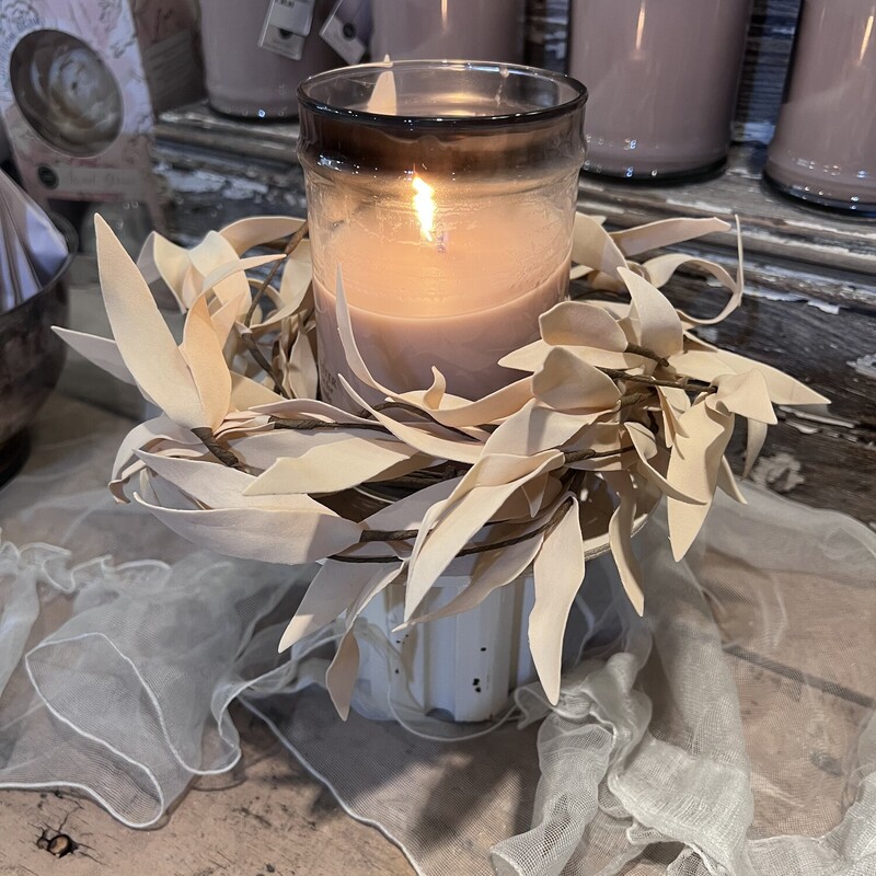 This Biege Leaves candle ring has soft foam leaves in a pretty shade of beige and would look great with any decor. It has a brown paper wrapped inner ring that is 4 inches in diameter and has an outter diameter of 10inches but can be fanned out further. This candle ring perfect for your favorite candle, we love it with our large Sweet Grace candle.