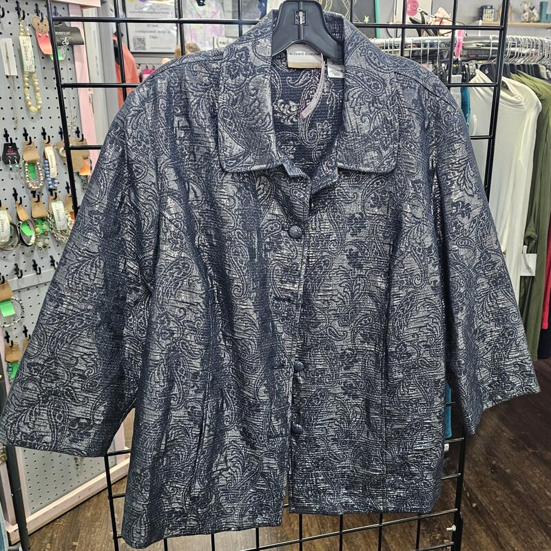 Love the sparkle and shine of this blazer! It is a jacket style blazer that can be dressed up or down depending on the occasion. A denim blue with silver design and half sleeves.