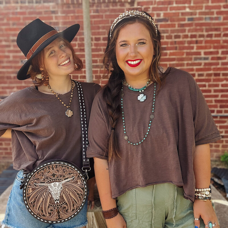 Another great Free People inspired top! This washed chocolate color is perfect for fall layering, or to pair with your favorite athletic shorts to be comfy. It fits 'boxy' for an oversized look!
Available is sizes small, medium, and large.

Madison is wearing a size Large. Anna is wearing a small.