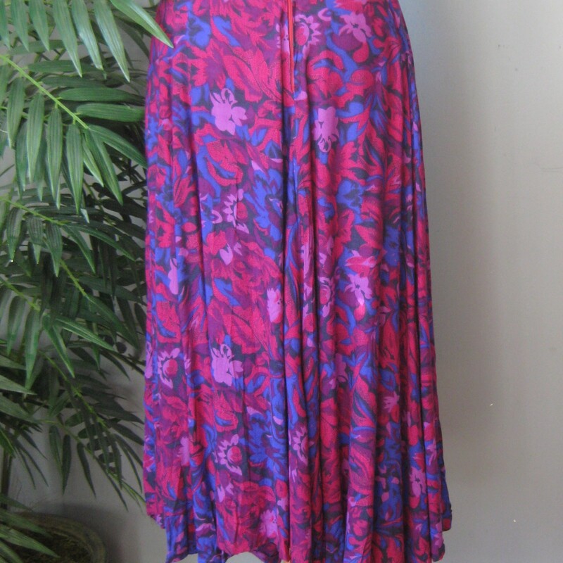 Vtg Handmade Floral, Purple, Size: Small<br />
This is a pretty flowy skirt from the early 80s or maybe even the 70s<br />
It was handmade of purple and pink floral fabric probably rayon<br />
It has a waist band and a center back zipper and pants sliding hook and eye closure/<br />
unlined<br />
Great condition but amateur sewing.<br />
Cute though!<br />
Should fit a size small to medium<br />
Flat measurements:<br />
waist:  14.5<br />
hip: free<br />
length: 32.5<br />
<br />
<br />
Thanks for looking!<br />
#57936