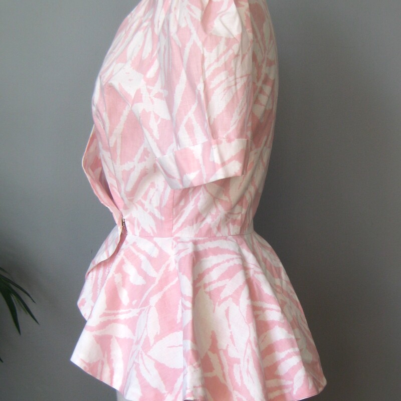 Vtg Ruffle, Pink, Size: Small<br />
This is a handmade top in peachy pink and white with puffy short sleeves and a deep v surplice wrap necklilne.<br />
No labels but feels like nice crisp cotton.<br />
It closes with a slide hook and eye at the waist<br />
<br />
Excellent condition, no flaw<br />
<br />
Here are the flat measurements, please double where appropriate:<br />
shoulder to shoulder: 16<br />
armpit to armpit: 17.5<br />
waist: 11.5<br />
length: 26<br />
<br />
Thanks for looking!<br />
#60695