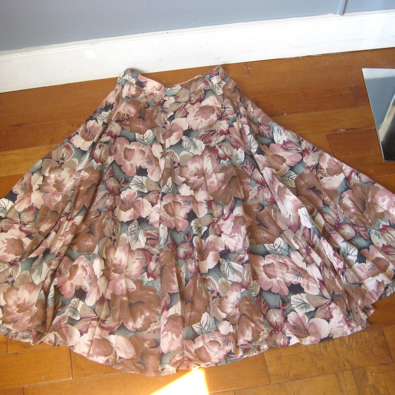 Vtg Handmade Floral, Tan, Size: Small<br />
This is a pretty flowy skirt from the early 80s or maybe even the 70s<br />
It was handmade of mauvey and tans floral fabric probably rayon<br />
It has a waist band and a center back zipper and pants sliding hook and eye closure/<br />
unlined<br />
very full!<br />
Great condition but amateur sewing.<br />
Cute though!<br />
Should fit a size small to medium<br />
Flat measurements:<br />
waist:  14.5<br />
hip: free<br />
length: 34<br />
<br />
<br />
Thanks for looking!<br />
#57983