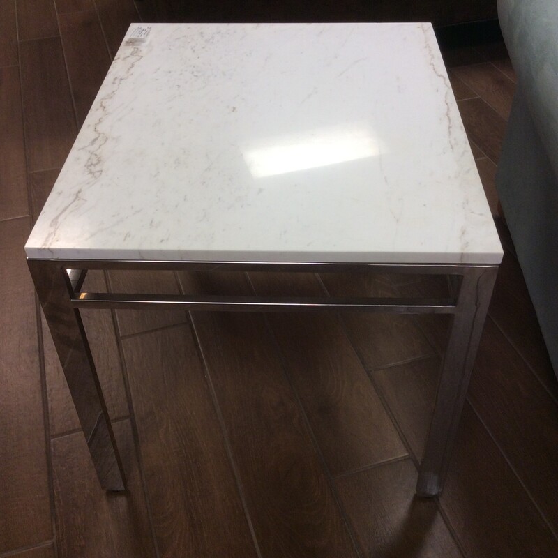 Streamlined and elegant, this modern side table suits many spaces and sits well with many sofa styles. This Bob Mitchell table has a beautiful grey w/white Onyx top, that lays on a chrome base.