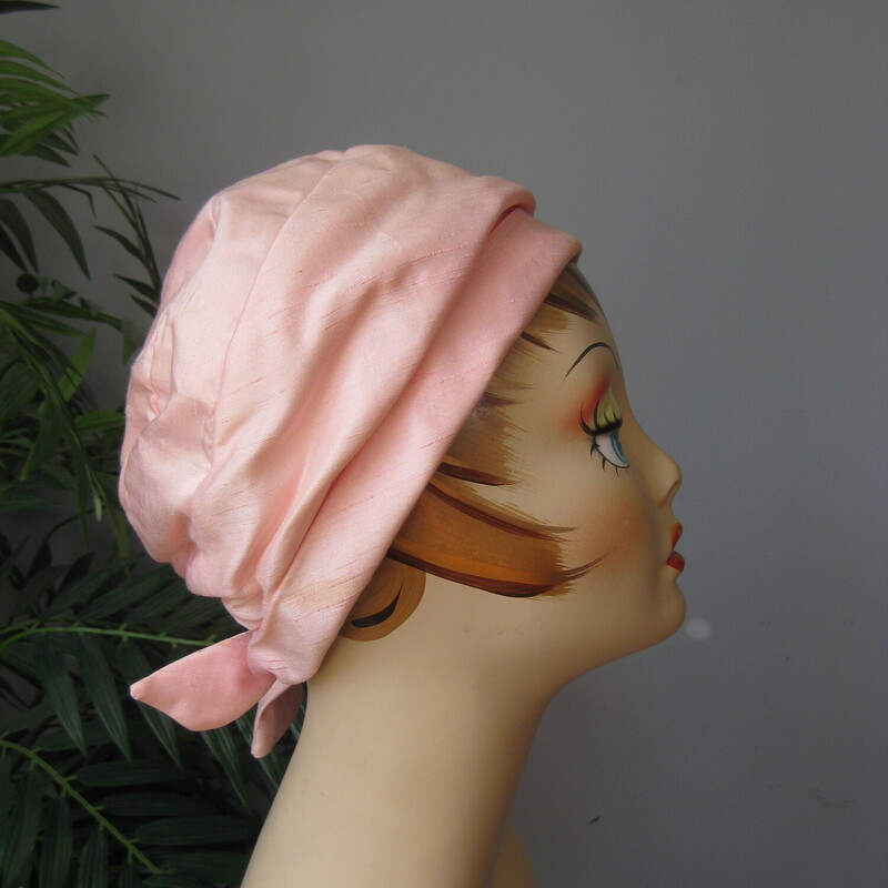 This cool hat is from G. Fox . It's made of silver,pink shantung like fabric (not sure if it is real silk)  and it has a cute little bow at the back<br />
<br />
Union label<br />
Great vintage condition.  There is a small mark on the interior edge as shown, also one edge of one of the tails of the bow has some fraying.<br />
<br />
Inner hat band measurement: 20.75<br />
<br />
Thank you for looking!<br />
#51305