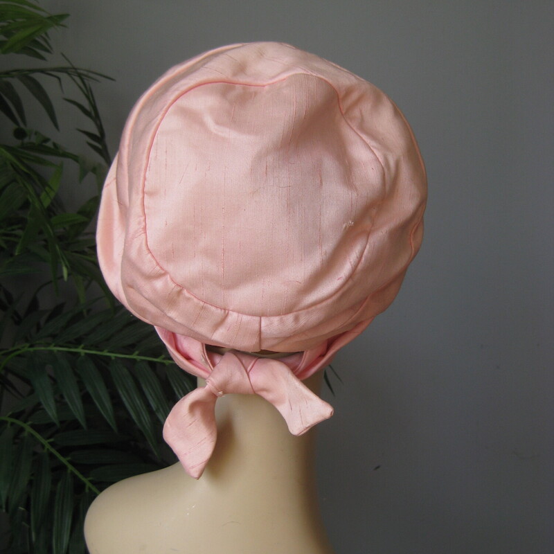 This cool hat is from G. Fox . It's made of silver,pink shantung like fabric (not sure if it is real silk)  and it has a cute little bow at the back<br />
<br />
Union label<br />
Great vintage condition.  There is a small mark on the interior edge as shown, also one edge of one of the tails of the bow has some fraying.<br />
<br />
Inner hat band measurement: 20.75<br />
<br />
Thank you for looking!<br />
#51305