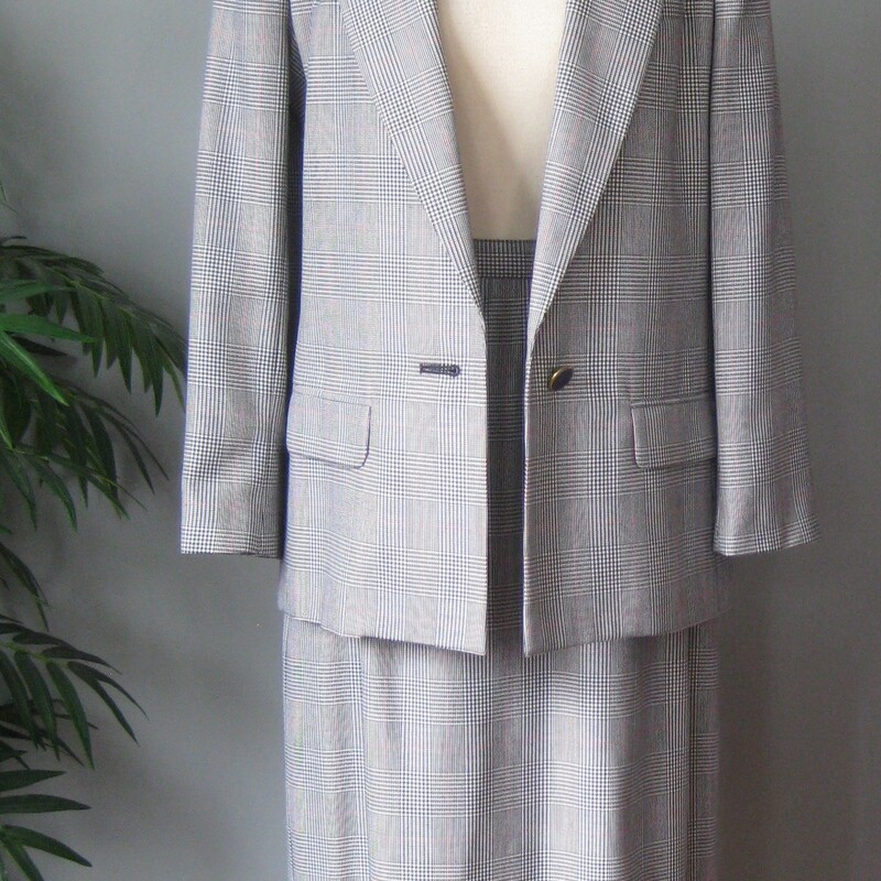 This is a nice Worhtington suit from the 1980s.    Standard cut and very good quality<br />
Poly/rayon blend in a black and white glen plaid check pattern.<br />
Jacket:<br />
Single button vented built in shoulder pads fully lined decorative (not functional) pockets<br />
buttons are black plastic circles set in gold metal.<br />
On me (size 10, bust 39, waist 31 with slightly longer than average arms) I like the look of this jacket but found the armholes a teeny bit too high for my frame and the sleeves a teeny bit shorter than i l ike.  I would totally wear this jacket though, probably not with the skirt but over jeans and heeled sandals with a good small bag.<br />
Flat measurements:<br />
shoulder to shoulder: 15.5<br />
armpit to armpit: 20<br />
waist area: 18.75:<br />
length: 30<br />
underarm sleeve seam: 17<br />
straight skirt center back button zipper closure fully lined<br />
Here are the measurements:<br />
Waist : 14.5 (will sit on natural waist)<br />
Hips: 21 1/8<br />
Length: 29 1/8<br />
<br />
Excellent condition no flaws<br />
<br />
Thank you for looking<br />
#1454