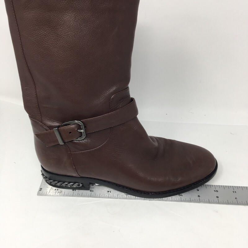 Nine West , Ceshirly leather, Brown with ankle strap, Carolinna Espinosa, made in China  Size: 7 fabric lining
10\" inch boot from shaft to mid calf,
1.25 \" inch heel with embedded gun metal chain detail.
Very soft brown leather, very gentle wear, great condition.