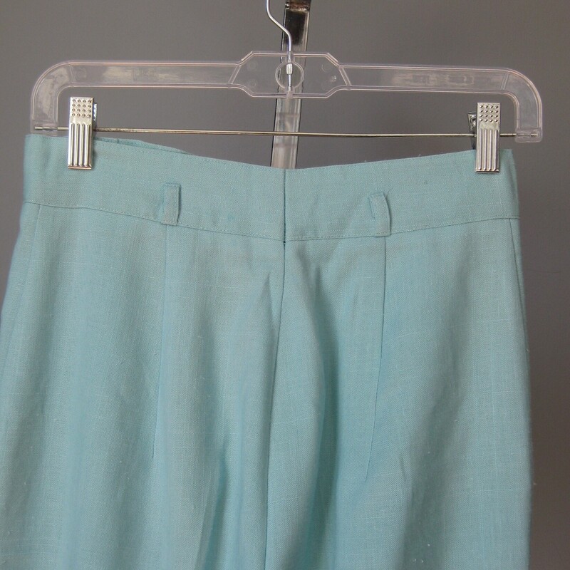 The sweetest pants from the 1970s with a high waist, pleated front, pockets and tapered legs in pastel blue<br />
NO tags<br />
Button and zipper fly<br />
unlined<br />
No fabric tags but feels like a cotton poly or cotton rayon blend.<br />
<br />
Excellent condition, no flaws<br />
<br />
flat measurements:<br />
waist: 13.5<br />
hip: 22<br />
rise: 13.5<br />
inseam: 29<br />
side seam 41<br />
<br />
thanks for looking!<br />
#60693