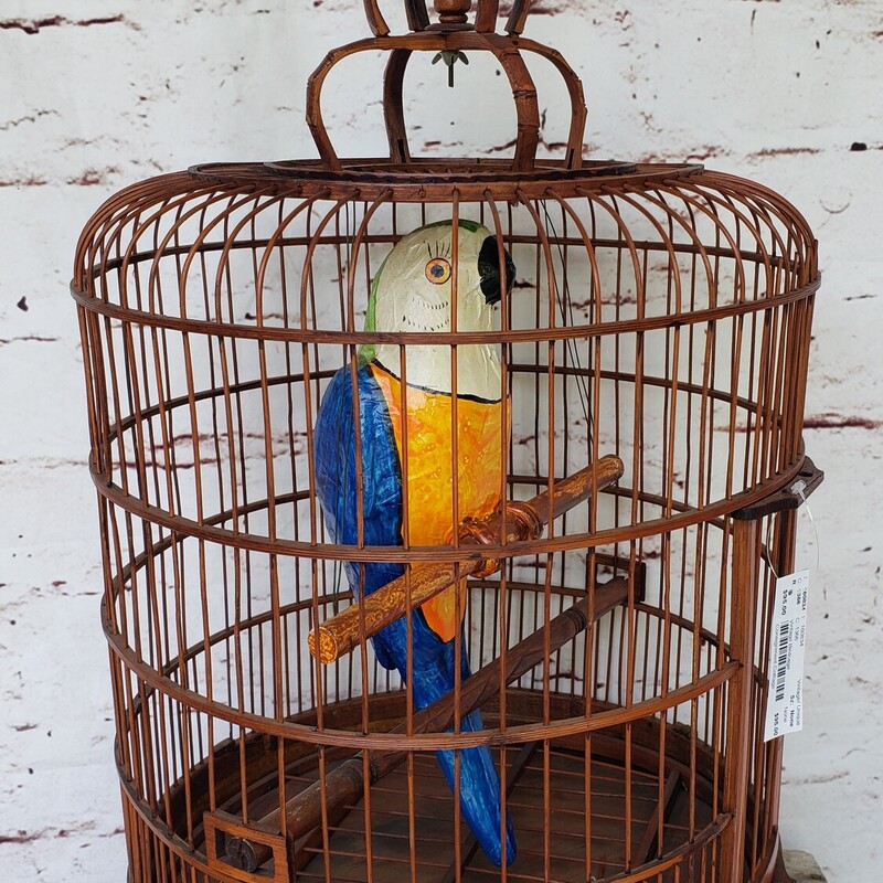 Vintage Birdcage. Rattan cage with paper mache parrot. Size: 29in tall