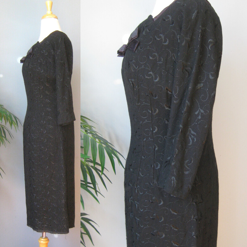 This black wool dress by DRA Original is trimmed with black satin and embroidered all over in black flowers.<br />
It's fitted sheath<br />
unlined<br />
It needs to be hemmed.<br />
Otherwise great condtion, with a thread of the embroidery pulled here and there.<br />
<br />
Here are the flat measurements, please double where appropriate:<br />
<br />
Waist: 15<br />
Hip: 19<br />
Armpit to Armpit: 19 1/2<br />
Underarm sleeve seam length: 16<br />
Length in current unhemmed state: 40.5<br />
<br />
Thank you for looking.<br />
#51279