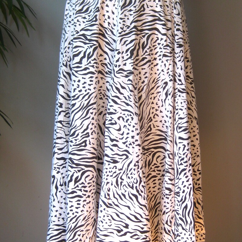 This is a pretty flowy skirt from the early 80s or maybe even the 70s
It was handmade of black and white abstract animal print in cotton or possible rayon
It has a waist band and a center back zipper and pants sliding hook and eye closure/
unlined
very full!
Great condition.
Cute though!
Should fit a size small to medium
Flat measurements:
waist:  13.75
hip: free
length: 31.5


Thanks for looking!
#57930