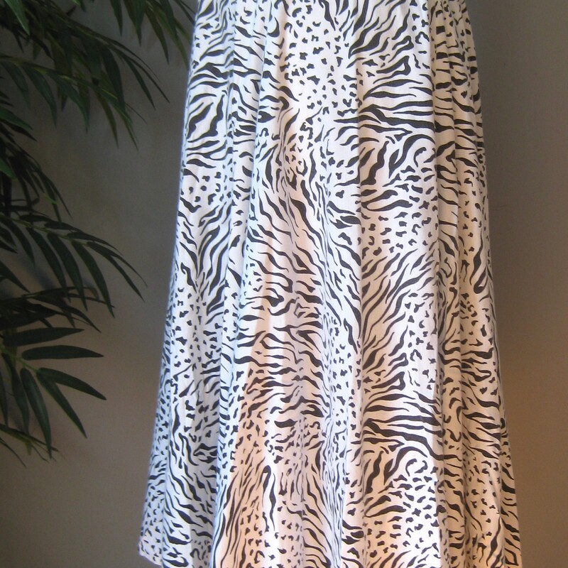 This is a pretty flowy skirt from the early 80s or maybe even the 70s<br />
It was handmade of black and white abstract animal print in cotton or possible rayon<br />
It has a waist band and a center back zipper and pants sliding hook and eye closure/<br />
unlined<br />
very full!<br />
Great condition.<br />
Cute though!<br />
Should fit a size small to medium<br />
Flat measurements:<br />
waist:  13.75<br />
hip: free<br />
length: 31.5<br />
<br />
<br />
Thanks for looking!<br />
#57930