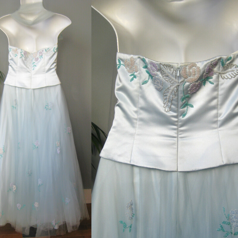 Extravagant formal ball gown by Lillie Rubin<br />
It's ice blue, very pale<br />
It has a boned strapless bodice beautifully decorated with floral beading.<br />
the skirt has three layers of tulle, the top one embroidered with the same floral beading.<br />
It has a net petticoat with a flounce to help the skirt pouf out<br />
next to the skin is a smooth satin-y layer.<br />
It comes with a long tulle scarf also embroidered with the multi-color floral beading<br />
Marked size 14 please use the measuremenst below as your ultimate guide to whether it will fit YOU. I am here to help with any fitting questions you might have.<br />
<br />
Flat measurements,<br />
Bust: 40<br />
Waist: 16<br />
Hip: free<br />
Length: 52 from the center of the bodice to the hem.<br />
<br />
Condition: excellent, no flaws<br />
#3679<br />
Thanks for looking!<br />
#51969