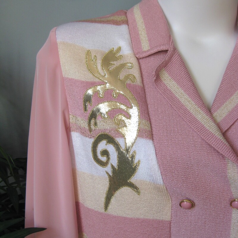 Vtg Philippe Shimmer, Pink, Size: L<br />
Awesome quintessential 80s style knit pullover.<br />
It's by Phillipe Marques<br />
It's designed to look like a double breasted blazer or cardigan but it's a henley pullover.<br />
Big shoulder pads<br />
<br />
The body, cuffs and banded waistline are knit, probably acrylic but the garment doesn not have any fabric ID tags.<br />
the sleeves and the back are thin woven polyester.<br />
on the front are yellow, pink and white stripes topped with applied gold satin scrolls<br />
The decorative buttons are pink plastic circles set in rope turned gold metal<br />
<br />
CONDITION:<br />
Alas it's not in perfect condition<br />
There is a spot on the front near one of the buttons as shown<br />
There are dark marks on the back of one of the sleeves (I tried to get this out without success)<br />
There are some fabric imperfections on the back across the shoulders.<br />
All these are pictured.<br />
Item is priced accordingly, I would wear this and I don't believe any gal who buys and wear vintage or thrifted items would be unhappy with it.<br />
<br />
It fits likee a large or even extra large but has no size tag.<br />
Here are the flat measurements, please double where appropriate:<br />
<br />
Shoulder to shoulder: 16 3/4<br />
armpit to armpit: 22 3/4<br />
underarm sleeve seam length: 17 1/2<br />
Length: 25 1/2<br />
width at hem: 17 stretches comfortably to 22, this will sit at the natural waist creating a slight blouson effect<br />
<br />
Thanks for looking!<br />
#54367