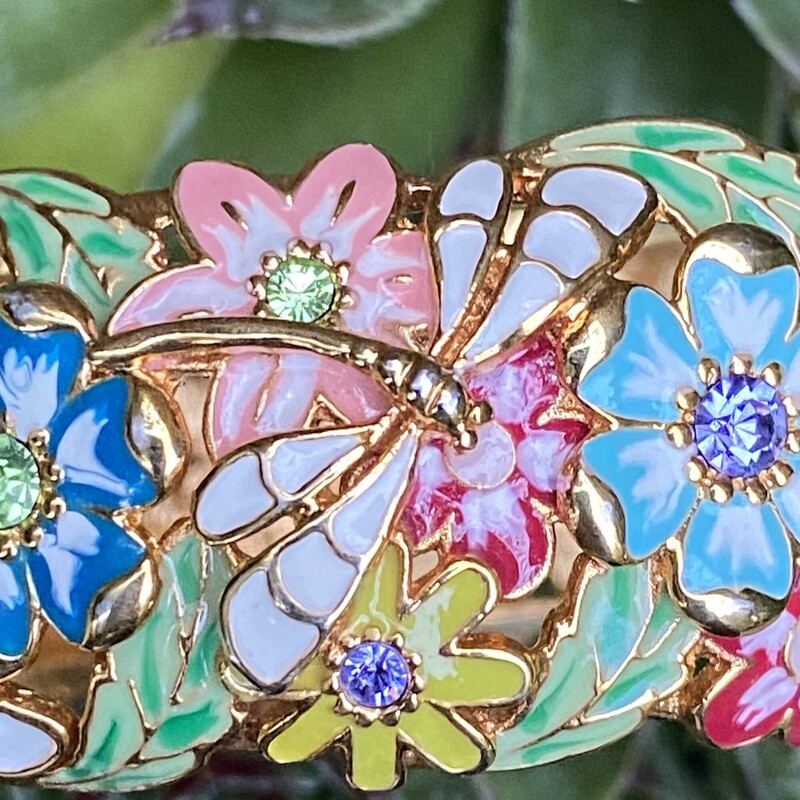 Joan Rivers Enamel Colorful Flowers Dragonfly Hinged Bracelet Gold Tone Rare HTF<br />
Goldtone oval shape; cutout floral design; epoxy enamel, round faceted crystals in shades of blue, lilac, and green<br />
Snap hinge<br />
Signed Joan Rivers<br />
Fits an average-sized wrist- Interior circumference measures approximately 7L<br />
Measures approximately 7/8W