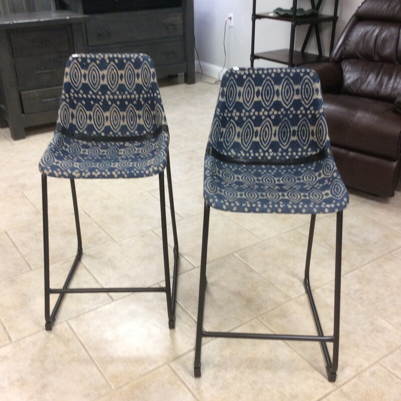 Each stool offers a mid-century modern bucket style seat, which offers complete comfort and long-lasting support. Wrapped on each seat is a bohemian woven fabric with a dark blue hue, as well as a black leather lining the back with a leather strap. Each chair seat is also supported by tall matte black legs,