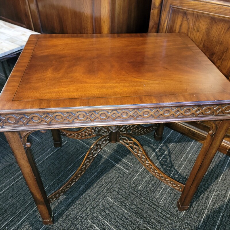Ethan Allen Newport Pierce Mahogany Occasional Table in good condition.  Does have scratches on top finish.  Has Pierced Mahogany base with Chippendale legs.  Measures 21' wide; 28' tall; 28' deep.