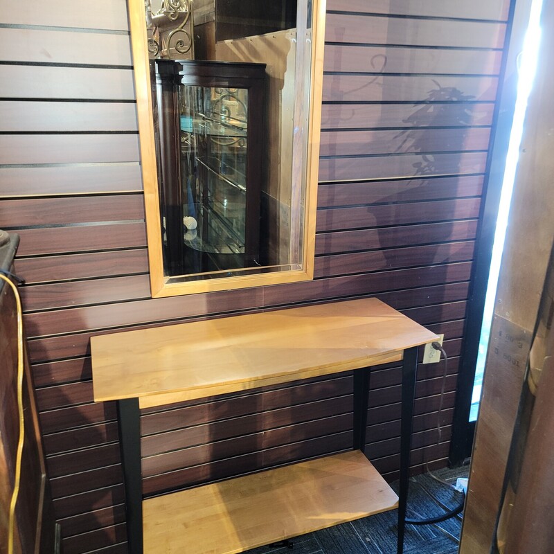 Ethan Allen Maple Contemporary Foyer Table w/ Mirror in excellent condition with metal legs.  Comes with matching mirror.   Looks like new!  Measures 36' wide; 32' tall; 15' deep.  Mirror Measures 20' wide; 36' tall.