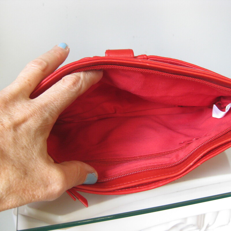 Vtg 80s Clutch, Red, Size: None<br />
Cute little red bag.<br />
We loved our clutches in the 1980s.<br />
This one abounds in sections and pockets.  It's not real leather but a very good quality faux that feels good in the hand.<br />
It has two side sections and an external zippered pocket.<br />
Everything snaps securely closed.<br />
gold hardware<br />
no tags<br />
<br />
11 x 7<br />
<br />
Excellent, like new, condition.<br />
<br />
Thank you for looking!<br />
#3400