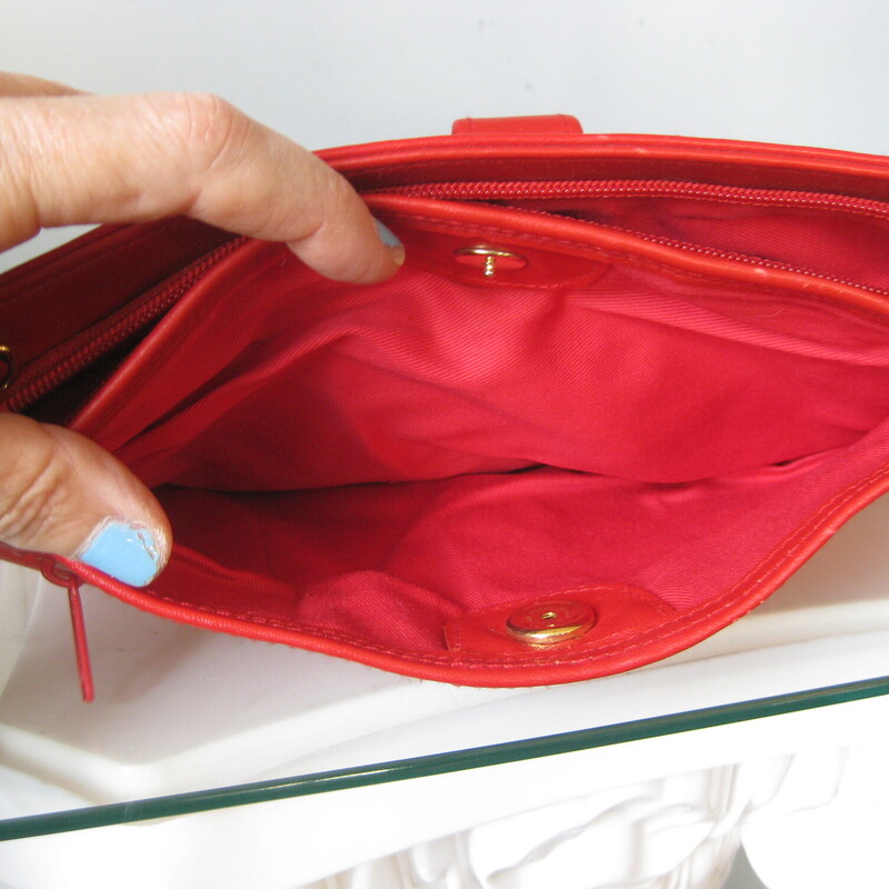 Vtg 80s Clutch, Red, Size: None<br />
Cute little red bag.<br />
We loved our clutches in the 1980s.<br />
This one abounds in sections and pockets.  It's not real leather but a very good quality faux that feels good in the hand.<br />
It has two side sections and an external zippered pocket.<br />
Everything snaps securely closed.<br />
gold hardware<br />
no tags<br />
<br />
11 x 7<br />
<br />
Excellent, like new, condition.<br />
<br />
Thank you for looking!<br />
#3400