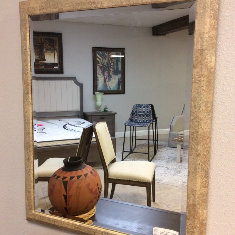 Bevel mirror in a taupe frame.