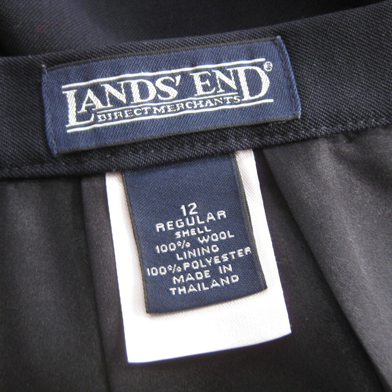 Super simple straight skirt in light weight tropical navy blue wool<br />
by Lands End<br />
fully lined with button, zipper and slacks style sliding hook and eye as closures<br />
kick vent in the back<br />
<br />
It's marked size 12, please use the flat measurements as your ultimate guide to fit.<br />
<br />
Waist: 15.75<br />
Hip: 23<br />
Length: 27<br />
<br />
Excellent condition!<br />
<br />
Thanks for looking.<br />
#52575