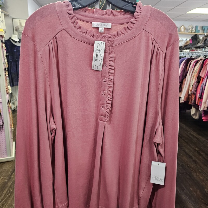 Brand new with tags, this long sleeve knit top is a pretty mauve with ruffle along the half button up front and collar.